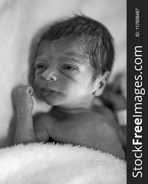 Grayscale Photo of Newborn Baby
