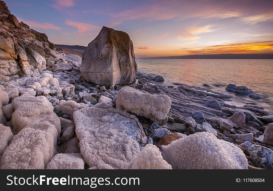 Gray Rock Formation on Seaside at Golden Hour