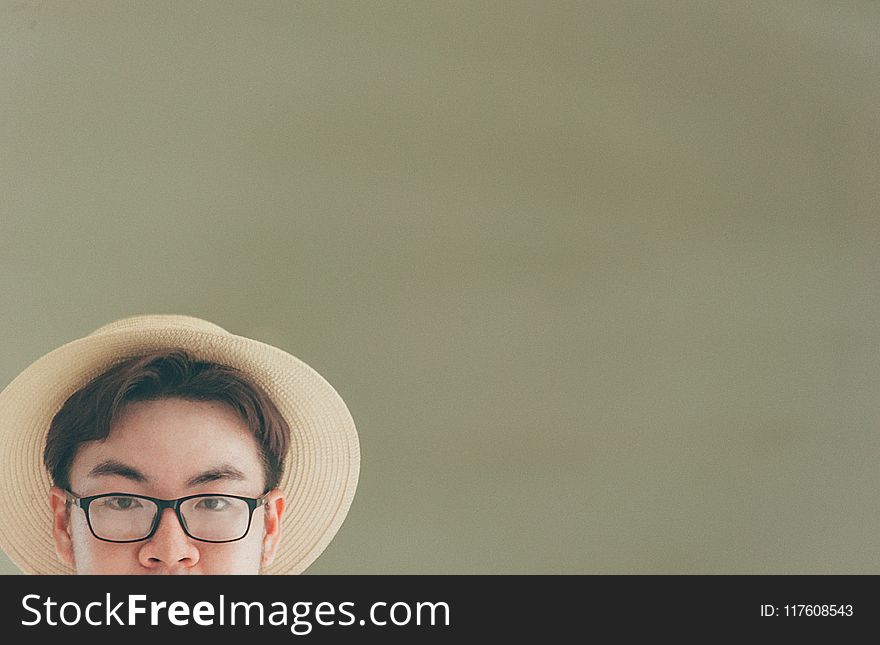 Man Wearing Brown Straw Hat