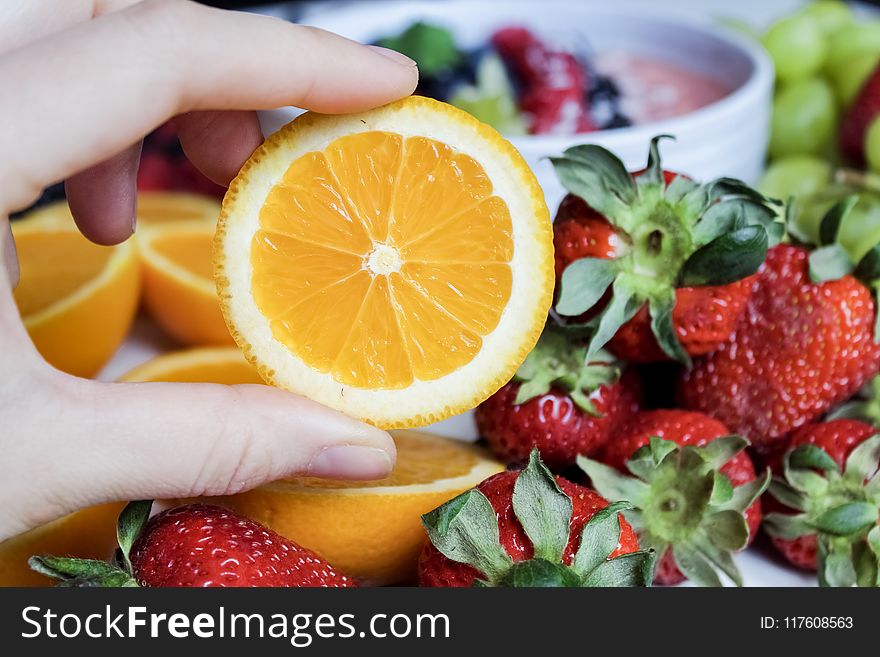 Slice Orange Fruit and Strawberries