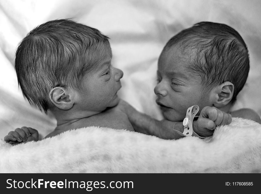 Grayscale Photography of Two Newborn