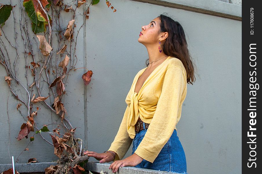 Woman In Yellow Long-sleeved Top