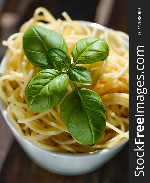 Green Basil Leaves on Top of Pasta