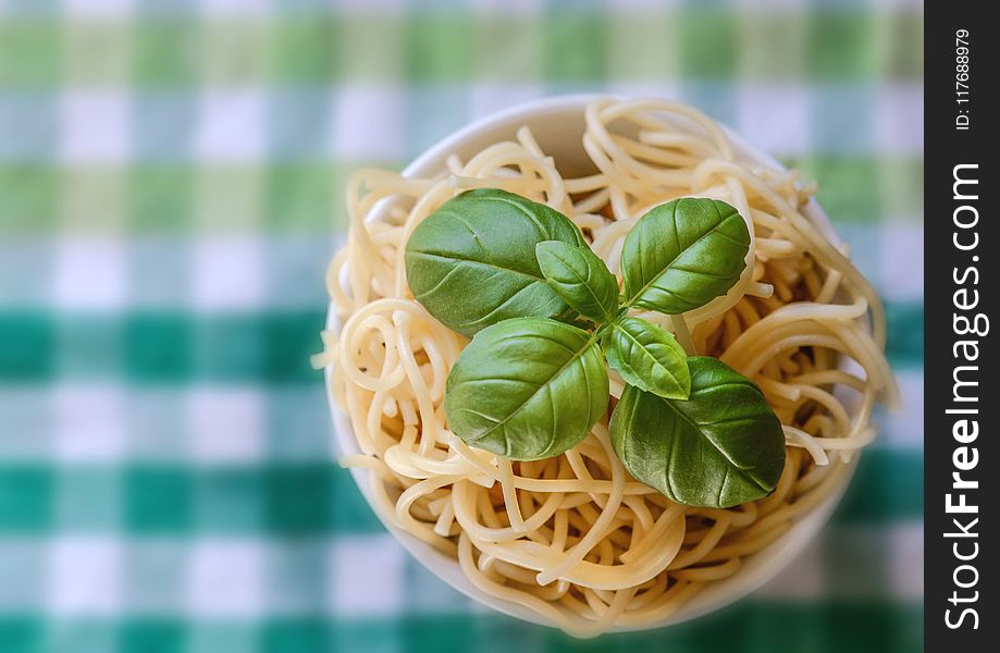 Selective Focus Photo of Noddles With Green Leaf Toppings