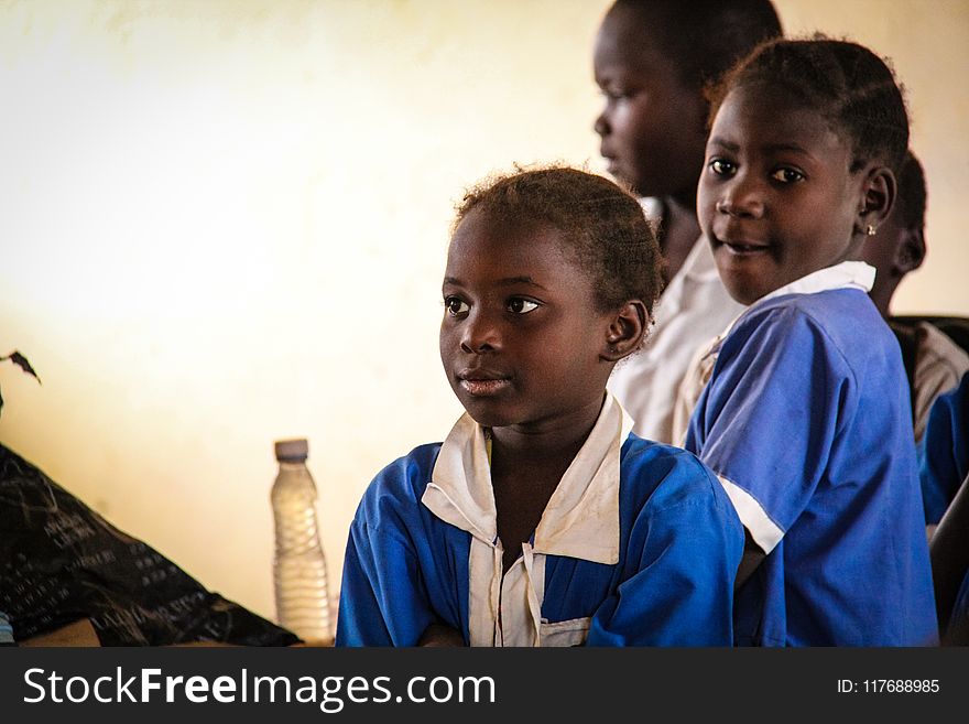 Three Children Wearing School Uniforms