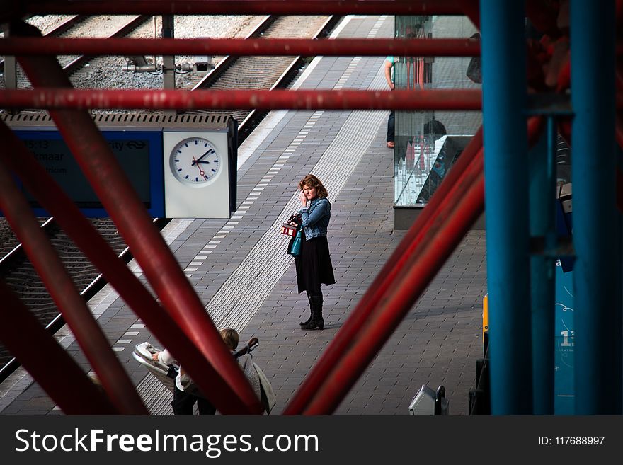 Woman Standing Near Rail Road