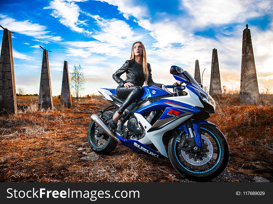 Woman In Black Leather Jacket Sitting On Blue And White Suzuki Gsx-r