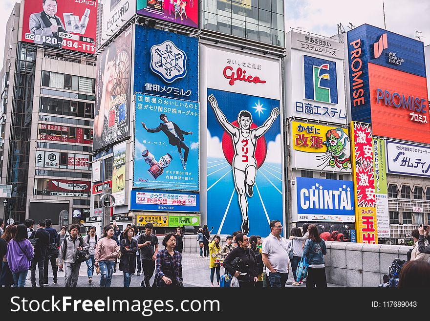 People Walks Near Electronic Billboards