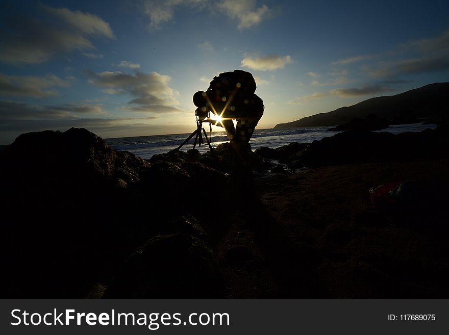 Man Taking Picture Of The Ocean