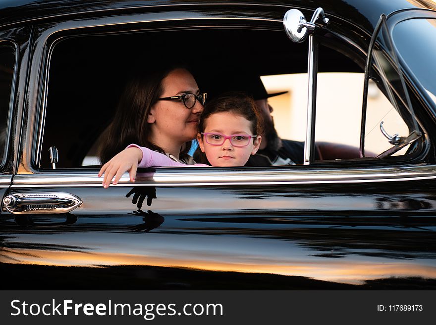 Woman And Child Inside Car