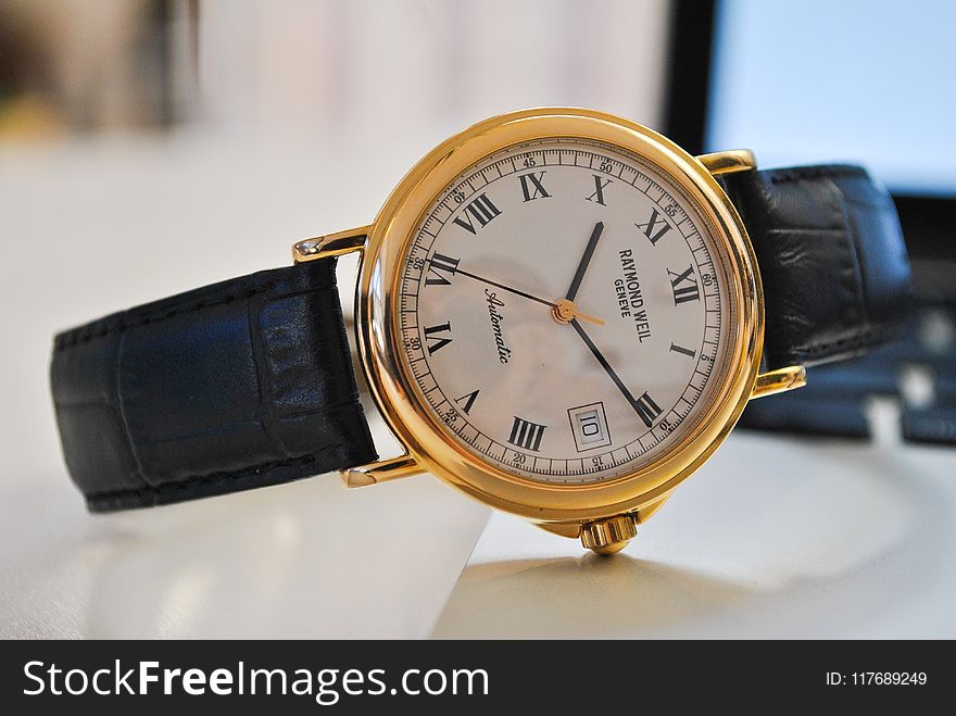 Round Gold-colored Analog Watch With Black Leather Strap At 10:10