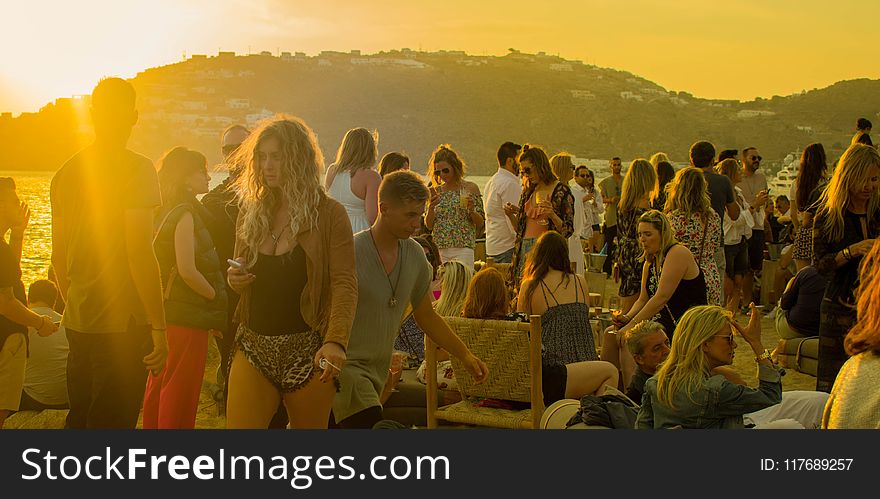 Crowd of People Gathering during Golden Hour