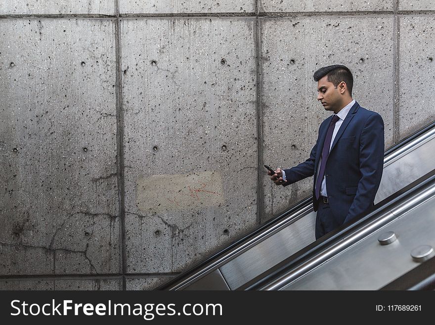 Man Looking at His Phone