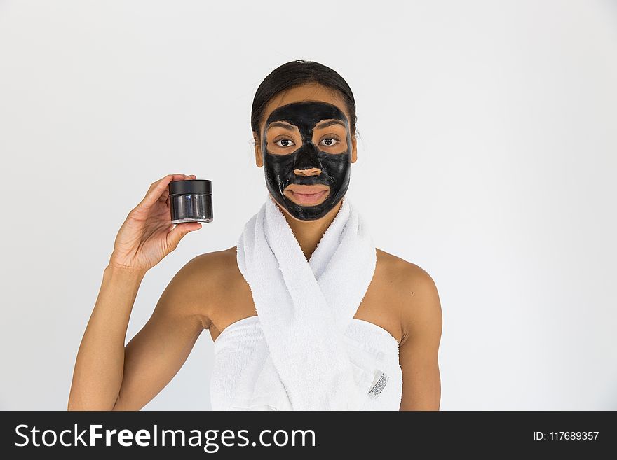 Woman Holding Black Mask