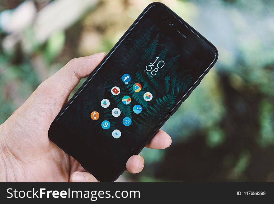 Person Holding Black Android Smartphone With Black Case