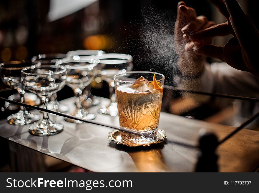 Bartender Sprinkling With An Orange Juice To The Delicious Fresh Cocktail