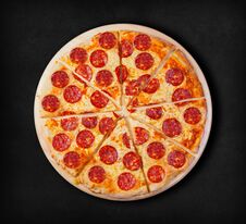 Pepperoni Pizza On A Black Background. Stock Image Pepperoni Pizza On A Black Background. Stock Image