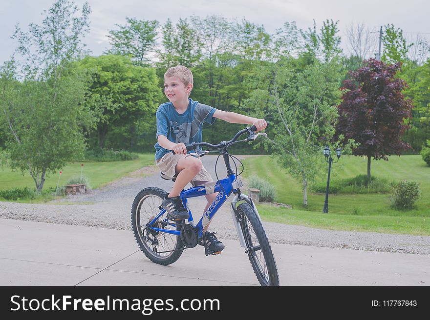 Boy Riding Bicycle