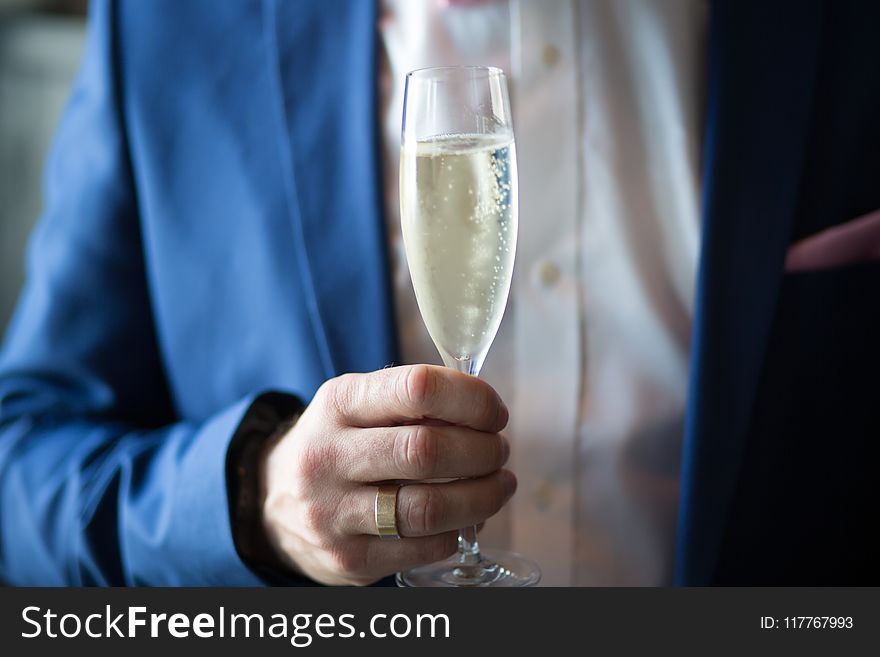 Man Holding Filled Champagne