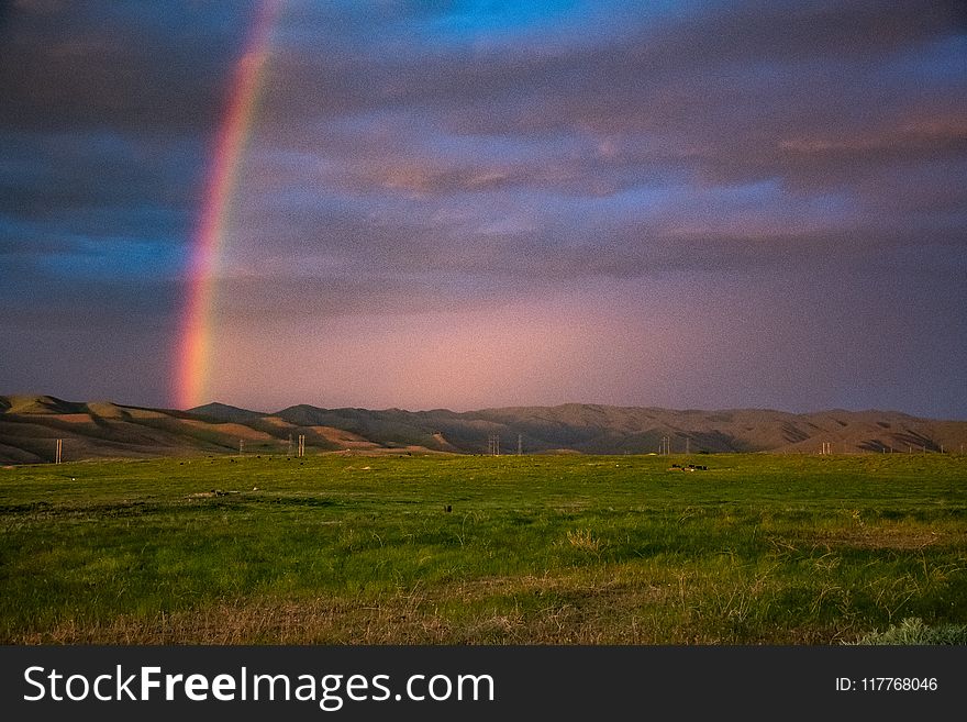 Landscape Photography of Mountains With Rainbow