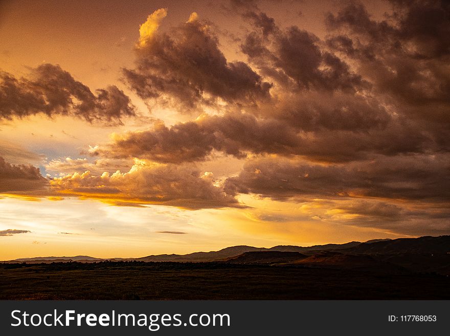 Orange Sunset With Clouds In Sky