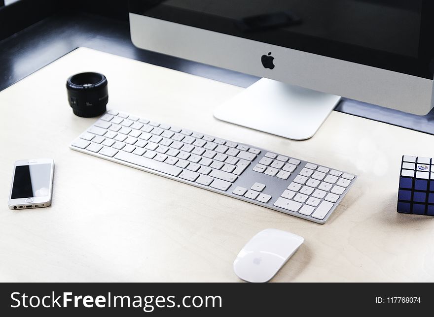 Imac Beside Apple Wireless Keyboard And Magic Mouse