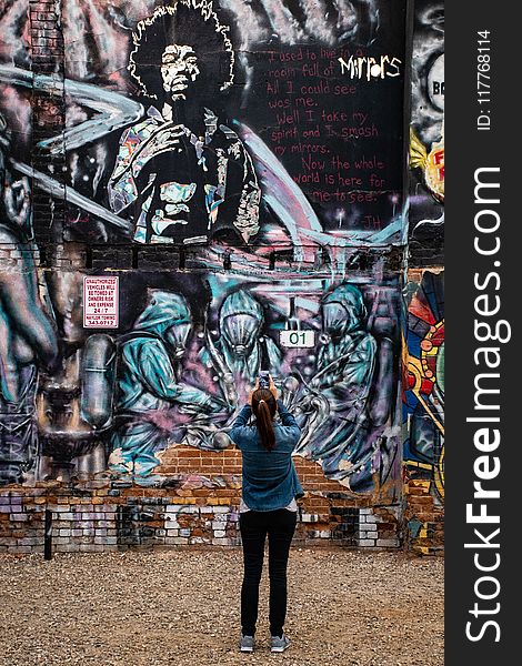 Photography Of A Woman Taking Picture