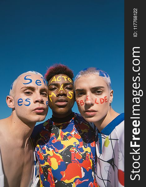 Three People With Face Paints