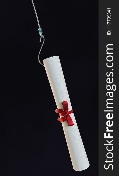 Rolled up diploma parchment with red silk ribbon attached to fishing line and hook over dark background. - 3D Illustration. Rolled up diploma parchment with red silk ribbon attached to fishing line and hook over dark background. - 3D Illustration