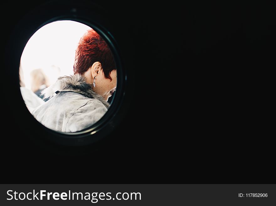 Person With Red Hair Wearing Gray Parka