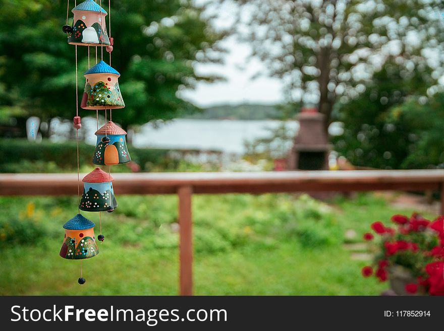 Shallow Focus Photography Of Windchimes