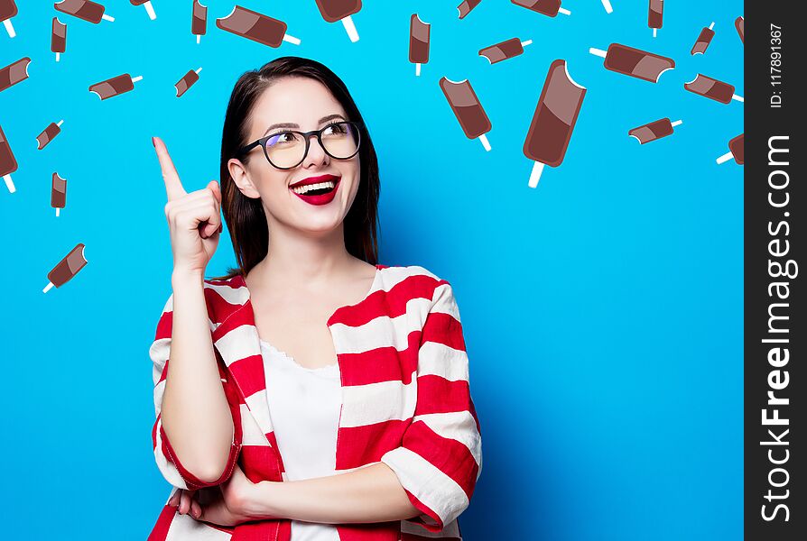 Woman On The Blue Background With Chocolade Ice-cream