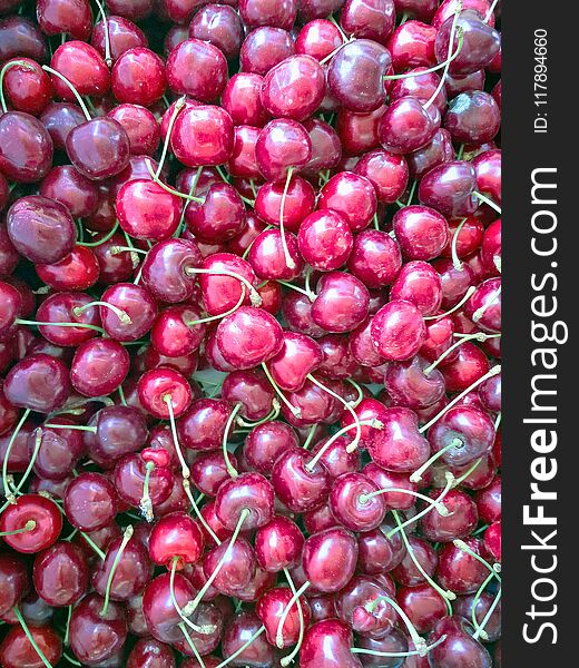 Group of ripe cherries. A large collection of fresh red cherries. Background of ripe cherries.