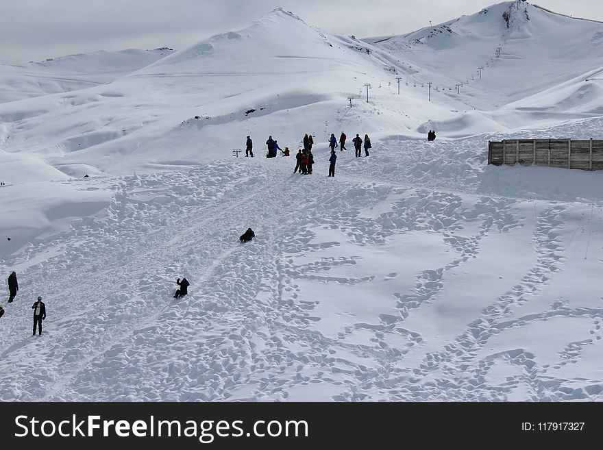 Person Walking on Snowfield
