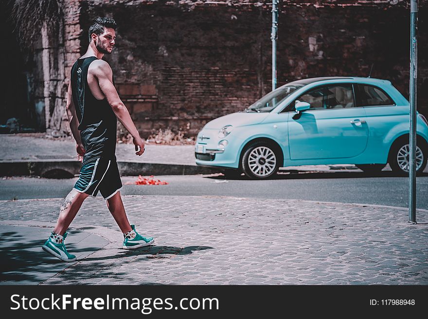 Man Wearing Black Tank Top Walking