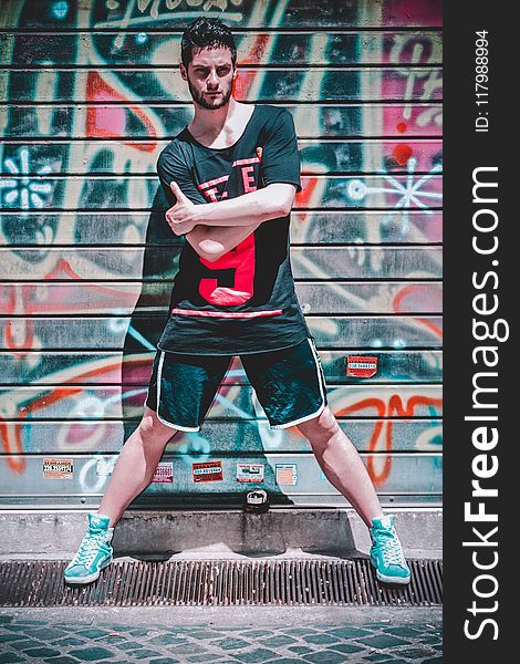 Man Wearing Black Black T-shirt And Black Gym Shorts