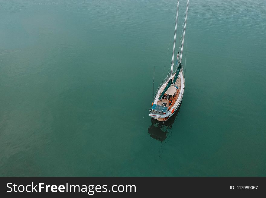 Aerial Photography Of Boat On Body Of Water