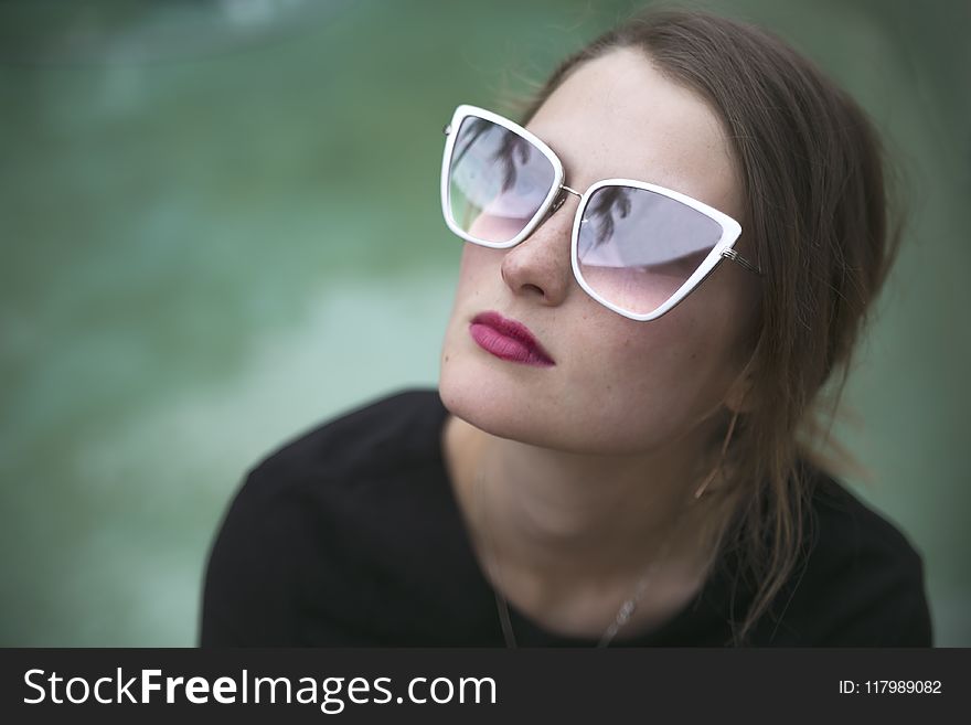 Woman Wearing Gray Framed Butterfly Sunglasses