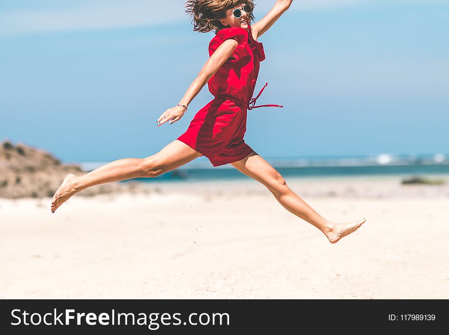Woman In Red Jumping