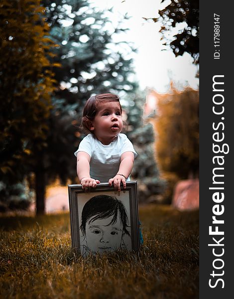 Girl Wearing White Shirt Holding Photo Frame