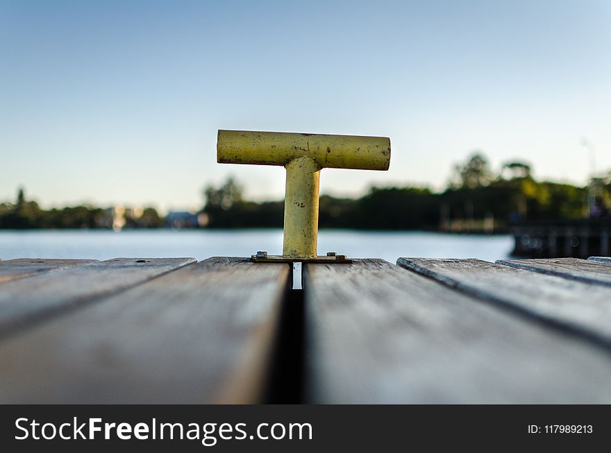 Selective Focus Photo Of Yellow Bollard