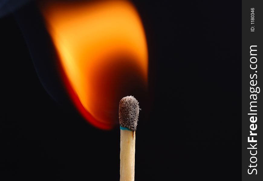 Closeup shot of a match just ignited. Closeup shot of a match just ignited