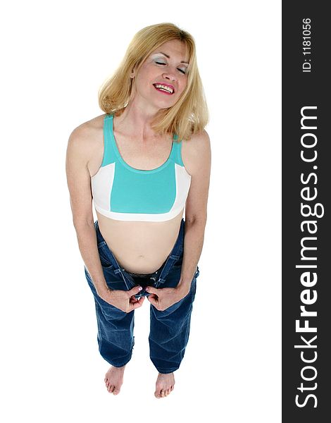 Beautiful Freshly Slim Middle Aged Woman Excited about losing weight and inches as shown by her former pair of pants. Beautiful Freshly Slim Middle Aged Woman Excited about losing weight and inches as shown by her former pair of pants.