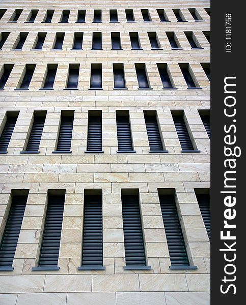 Facade of a modern business building with lots of thin windows. Facade of a modern business building with lots of thin windows.