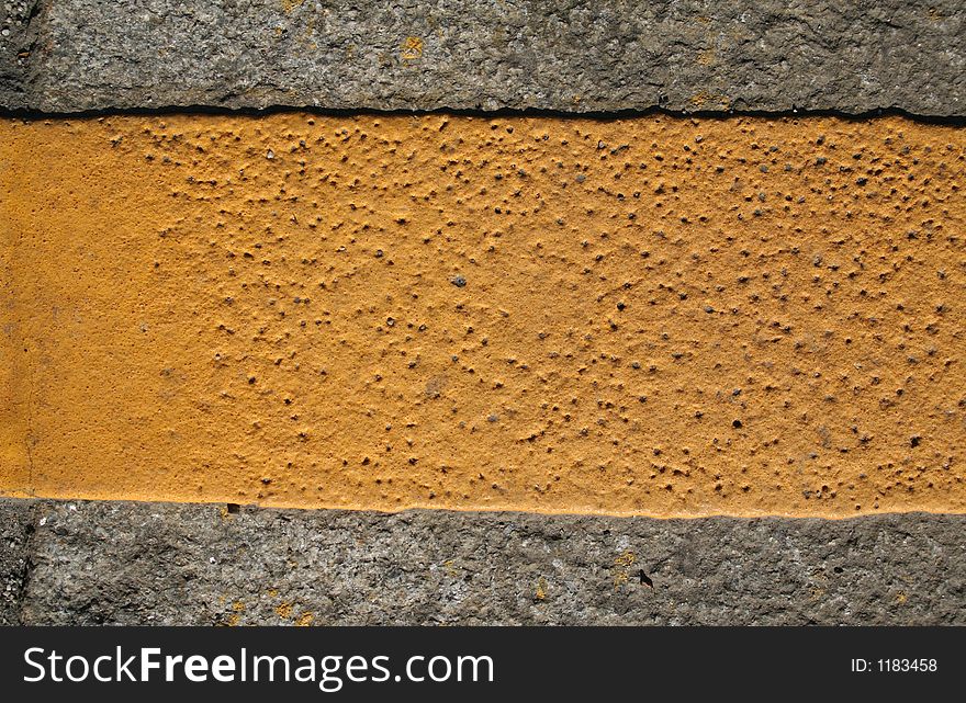 An abstract series with yellow paint on the grey pavement. An abstract series with yellow paint on the grey pavement