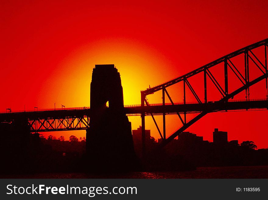 Silhouette of a bridge in the rising sun