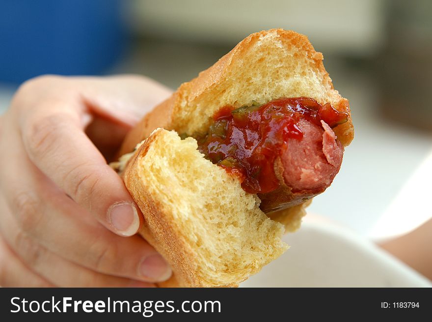 A hot dog being eaten