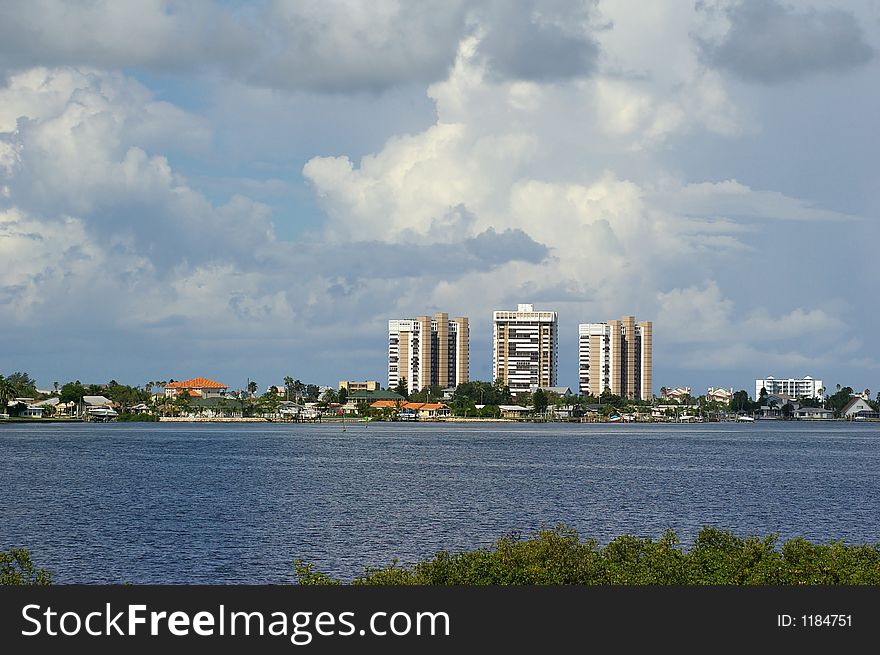 High Rise Apartment Buildings with storm coming in behind them across from Boca Ceiga Millinum Park, Seminole Florida. High Rise Apartment Buildings with storm coming in behind them across from Boca Ceiga Millinum Park, Seminole Florida