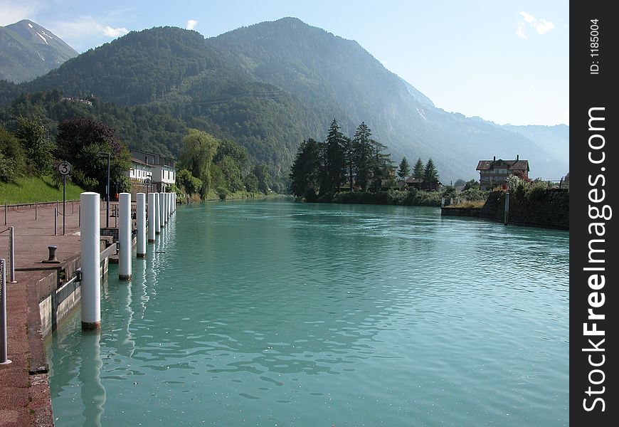 View of the Interlaken boat harbor and mountains. View of the Interlaken boat harbor and mountains