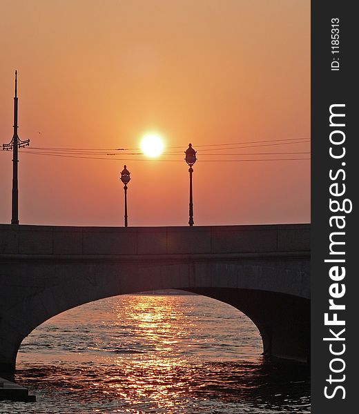 Sunset above the Neva bridge